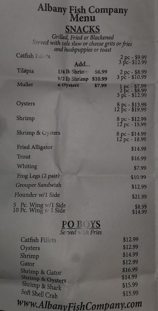 Seafood dishes served in a warm, lively dining room.