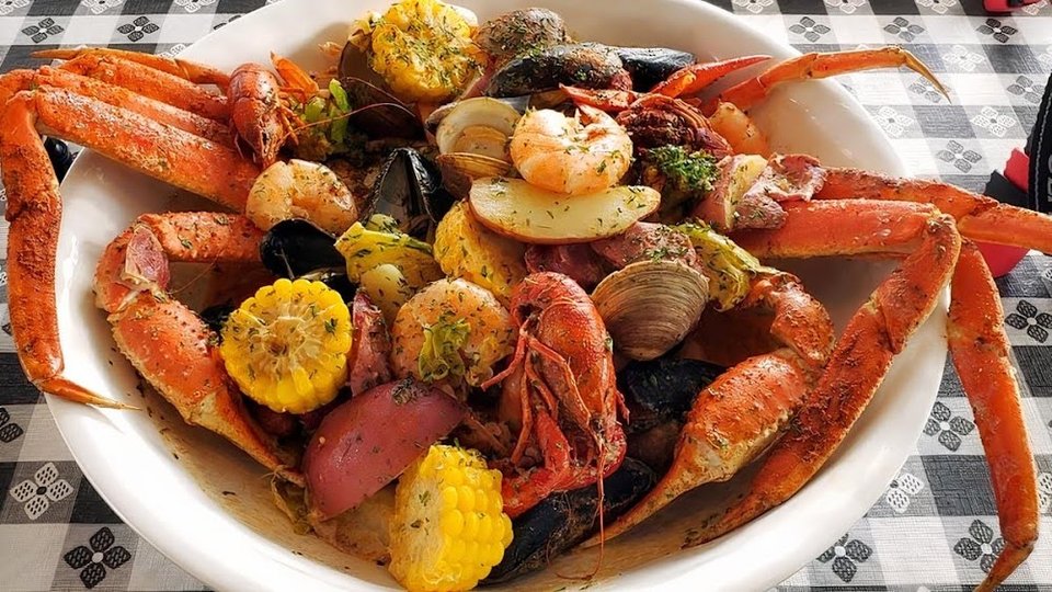 Menu page with seafood bowls, po boys, and sides.