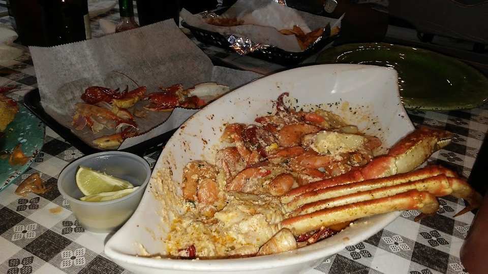 Seafood menu featuring salads, dinners, and small plates.