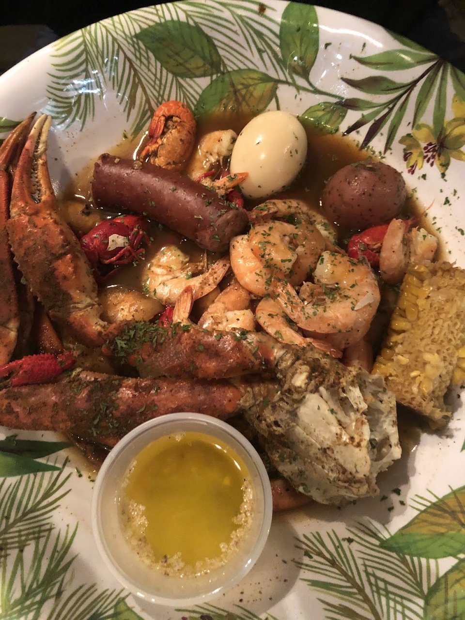 Printed menu showing seafood dishes and drink options.