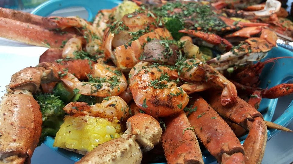 Menu page with seafood bowls, po boys, and sides.