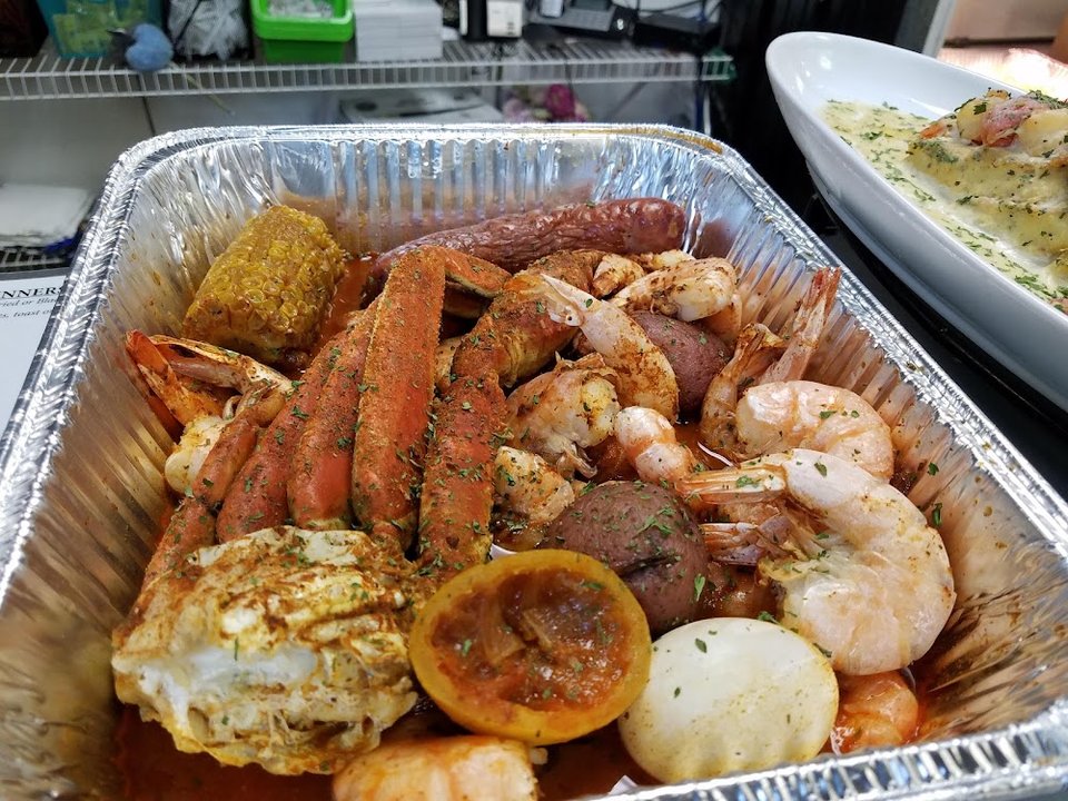 Seafood menu featuring salads, dinners, and small plates.