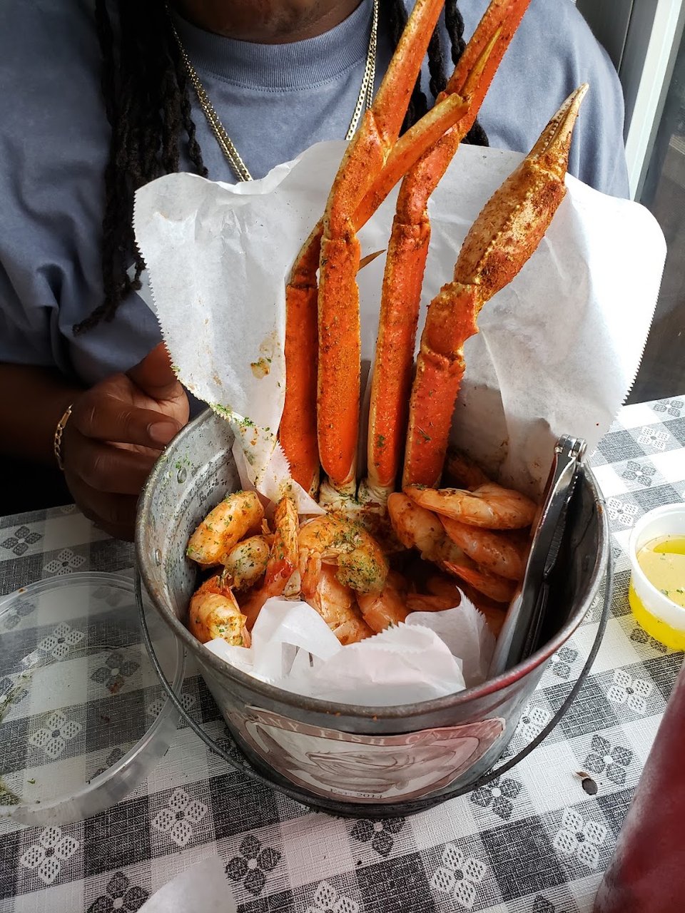 Menu page with seafood bowls, po boys, and sides.
